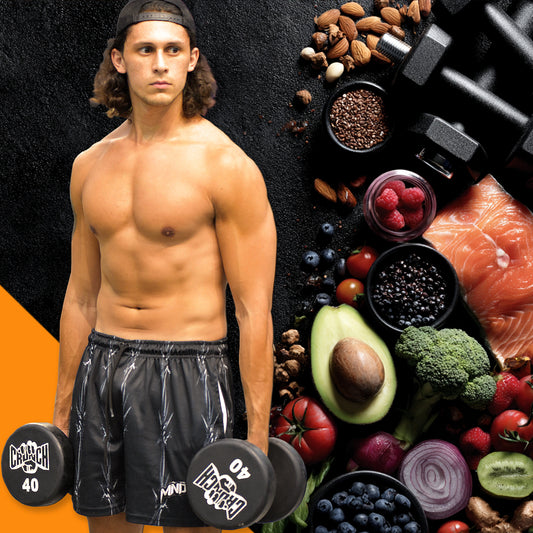 Joshua holding dumbbells with a variety of healthy foods and gym equipment on a black background
